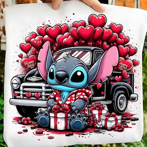 May include: White tote bag featuring a cartoon character with large ears, blue skin, and a red jacket, sitting in front of a black truck filled with red hearts. The bag has the text "Happy Holy" on a heart.