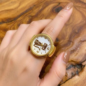 stylish finger watch ring for everyday wear
kitten inspired ring watch classy accessory