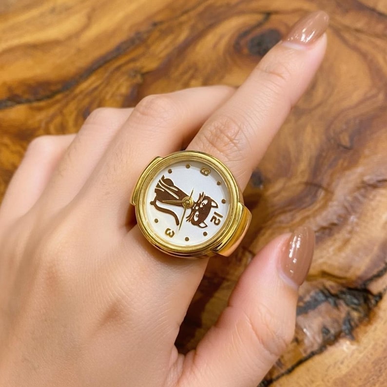 stylish finger watch ring for everyday wear
kitten inspired ring watch classy accessory