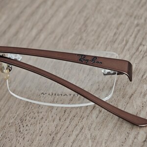 Ray-Ban RB8583 glasögonbågar utan bågar i titan – metallic brun – NOS bild 10