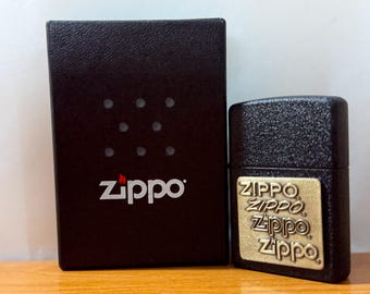 Zippo Black Crackle Lighter w/ Brass 4-Logo Evolution Emblem - NOS Unfired