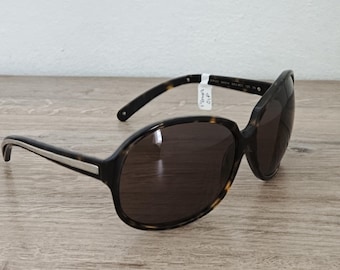 Gafas de sol PRADA SPR 21I extragrandes para mujer en color marrón habano, fabricadas en Italia - NOS
