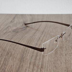 Ray-Ban RB8583 glasögonbågar utan bågar i titan – metallic brun – NOS bild 7