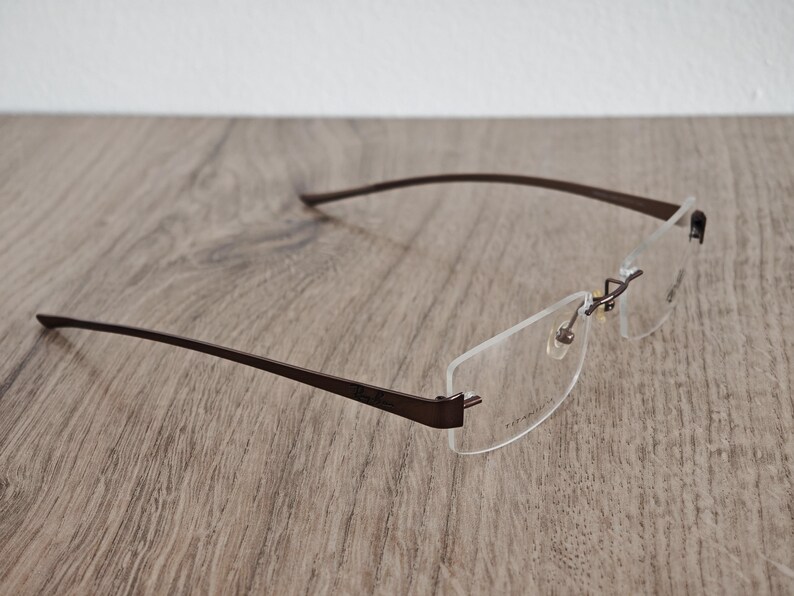 Ray-Ban RB8583 glasögonbågar utan bågar i titan – metallic brun – NOS bild 7
