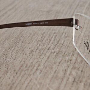 Ray-Ban RB8583 glasögonbågar utan bågar i titan – metallic brun – NOS bild 9