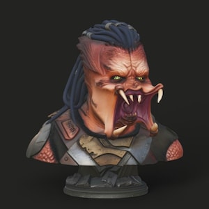 May include: A detailed bust of a Predator alien with a menacing expression. The sculpture features a red and orange face with sharp teeth, green eyes, and blue dreadlocks. The bust is set on a dark gray base, showcasing intricate armor details.