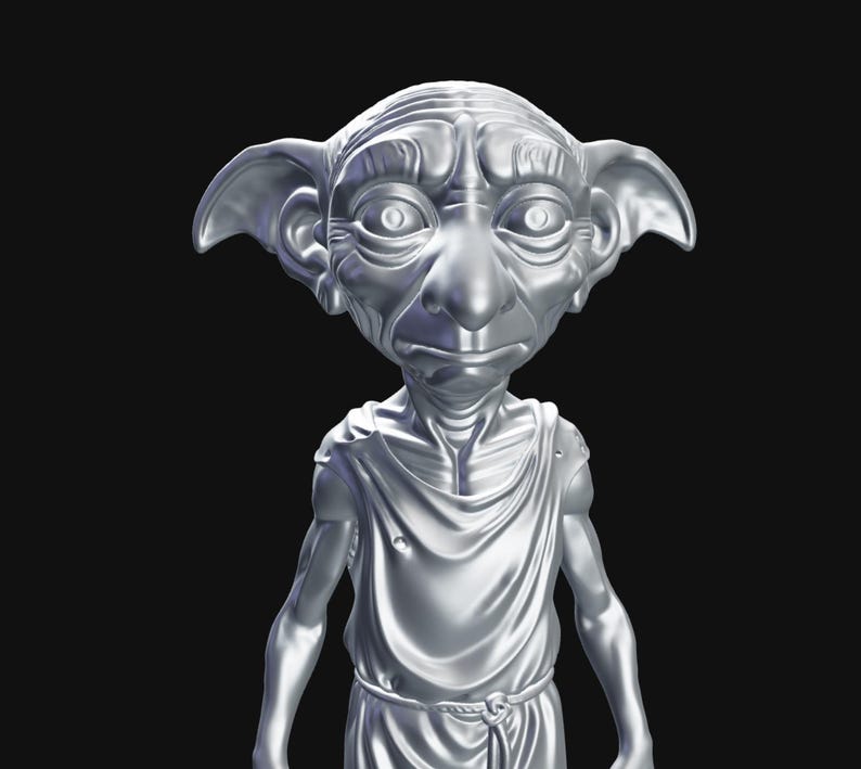 May include: A silver-colored statue of a house elf with large ears, a long nose, and a draped tunic. The figure has a detailed, textured appearance and is set against a black background. The statue is a representation of a character from a fantasy series.