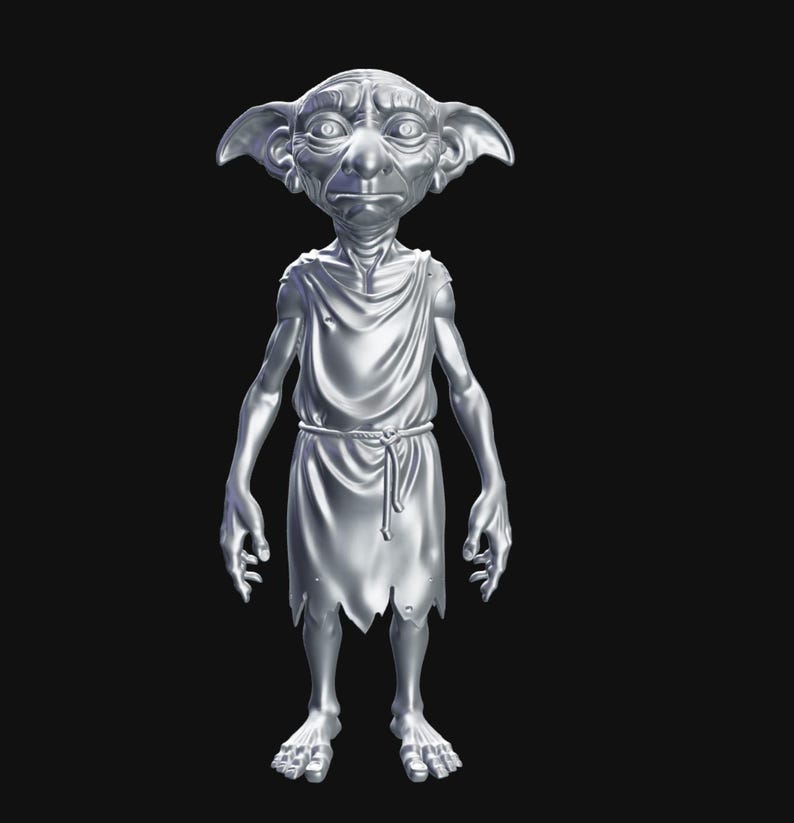 May include: A silver-colored statue of a fantasy creature with large ears, a wrinkled face, and a draped tunic. The figure is standing with its arms at its sides, and its feet are visible. The background is solid black.