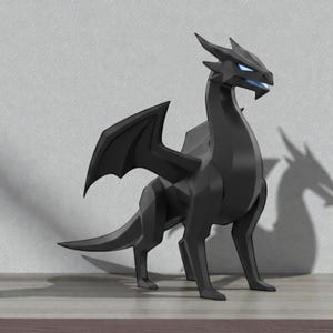 May include: A black dragon figurine with geometric features and blue eyes. The dragon has large wings and is standing on a wooden surface. The figurine's shadow is visible on the wall behind it.