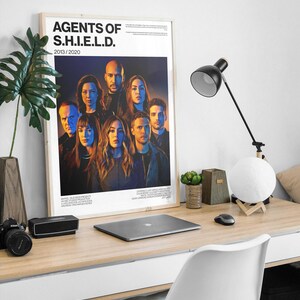 May include: A white ceramic mug with a black handle and the text "But First, Coffee" in a black, bold font. The mug is sitting on a wooden surface.