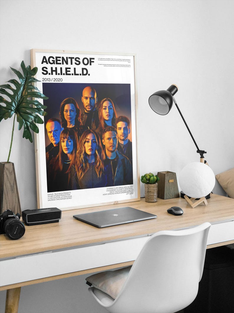 May include: A white ceramic mug with a black handle and the text "But First, Coffee" in a black, bold font. The mug is sitting on a wooden surface.