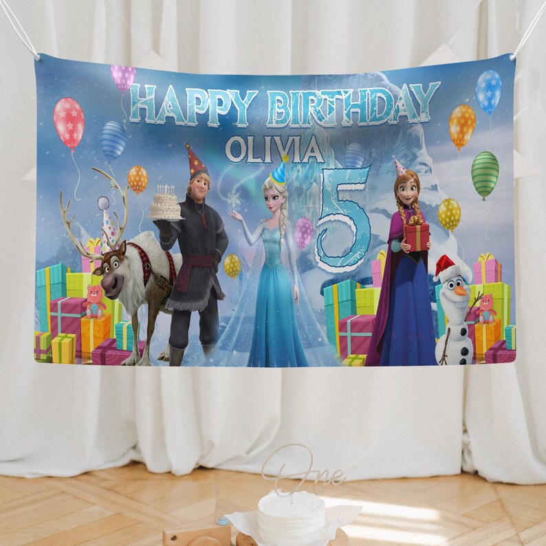 May include: A birthday banner featuring characters from the movie Frozen. The banner reads "Happy Birthday Olivia" with a large number "5". Colorful balloons and wrapped gifts decorate the scene. Characters include Elsa, Anna, Kristoff, Olaf, and Sven.