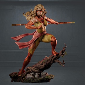 May include: A detailed statue of a female warrior in a dynamic pose, clad in a yellow and orange bodysuit with a flowing red sash. She holds a staff and stands on a tree branch, with a determined expression.