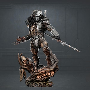 May include: A detailed Predator statue, depicting the alien warrior in a dynamic pose. The figure is clad in intricate armour, holding a spear and wrist blades. The base is a detailed, textured display with skulls and a tree-like structure.