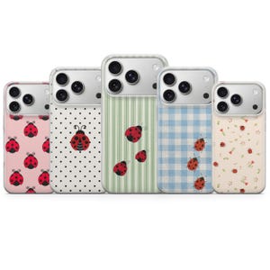 May include: Five phone cases with different designs. The cases feature ladybug patterns on pink, white polka dots, green stripes, blue gingham, and a cream floral print. Each case has a silver camera housing.