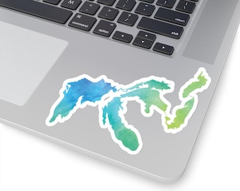 May include: A watercolor sticker of the Great Lakes in shades of blue and green. The sticker is on a silver laptop.