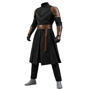 May include: A black costume with a high collar, brown shoulder pads, and matching arm guards. The outfit includes a brown belt, a long black skirt, black gloves, and black pants. The costume is completed with gray boots.