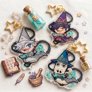 May include: A collection of fantasy-themed keychains and accessories. The keychains feature pixelated wizard characters in various outfits. Additional items include star-shaped charms, small glass bottles, a mortar and pestle, and a spell book.