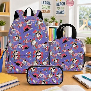 May include: A purple backpack, lunch bag, and pencil case set featuring a repeating pattern of cartoon characters in red and blue outfits with top hats. The items have black straps and zippers, displaying a consistent graphic print throughout.