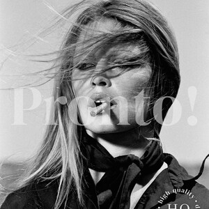 May include: A black and white portrait of a person with long, wind-swept hair, wearing a dark collared shirt and a tied neck scarf. The person has a cigarette in their mouth. The image includes the text "Pronto!" and "high quality digital download".