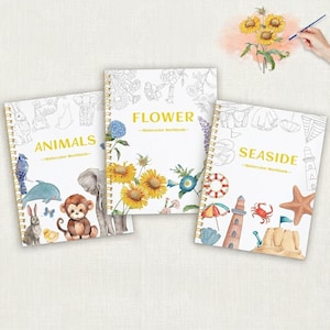 May include: Three spiral-bound watercolor workbooks titled ANIMALS, FLOWER, and SEASIDE. The ANIMALS book features illustrations of a rabbit, monkey, elephant, and dolphin. The FLOWER book shows yellow sunflowers and blue blossoms. The SEASIDE book displays a lighthouse, starfish, and crab.