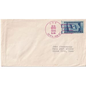 May include: Cream-colored envelope with a purple postmark from Iowa, dated December 28, 1946. A blue and purple Iowa Statehood Centennial stamp is in the upper right corner. The recipient's name and address are printed below.