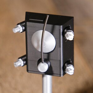 May include: A white ceramic mug with a black handle and the text "But First, Coffee" in a black, bold font. The mug is on a white surface. The mug is 10 cm tall.