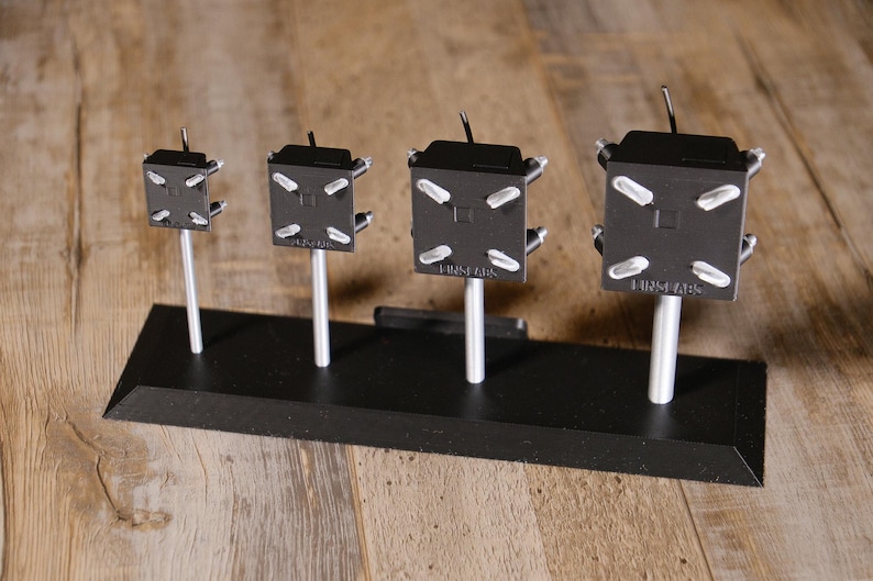 May include: A set of three ceramic mugs with a speckled, matte finish. Each mug is a different colour: light blue, cream, and grey. The mugs have a simple, modern design, ideal for coffee or tea.