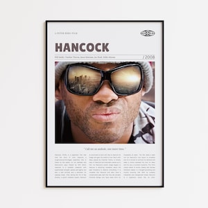 May include: Framed movie poster for "Hancock" featuring Will Smith wearing sunglasses reflecting a cityscape. The title "HANCOCK" is prominently displayed, along with the year 2008. The poster includes the quote, "Call me an asshole, one more time."