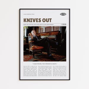 May include: A framed movie poster for "Knives Out" featuring Daniel Craig. The poster has a black frame and includes the film's title, cast, and the year 2019. The image shows Daniel Craig seated in a chair.
