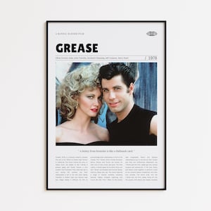 Può includere: Poster incorniciato del film "Grease" con Olivia Newton-John e John Travolta. Il poster include il titolo del film, l'anno 1978 e una citazione. L'immagine è in una cornice nera.