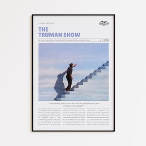May include: Framed poster for the film "The Truman Show". The poster displays the film's title in blue, the actors' names, and a scene of a man ascending stairs towards a blue sky. The year 1998 is also shown.