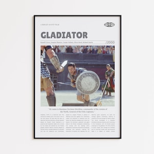 Könnte beinhalten: Gerahmtes Filmplakat für den Film "Gladiator" mit Russell Crowe. Das Poster hat einen schwarzen Rahmen und zeigt eine Szene aus dem Film mit Text oben und unten. Das Poster ist ein vertikales Rechteck.