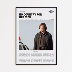 Könnte beinhalten: Ein gerahmtes Filmplakat für "No Country for Old Men" mit Javier Bardem. Das Poster enthält den Filmtitel, die Besetzung und das Jahr 2007. Das Bild zeigt einen Mann in einem braunen Hemd und einer Jacke.