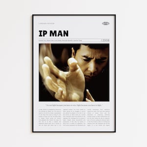 May include: Framed movie poster for "IP Man" with a black border. The poster features a close-up of a man's face and hand in a martial arts pose. Text includes the movie title, cast, and the year 2008.