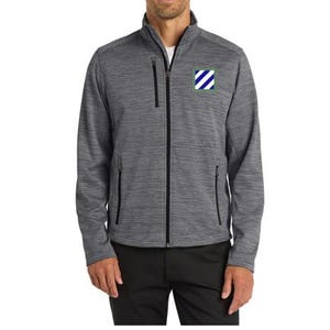 May include: A gray zip-up jacket with a subtle textured pattern. The jacket features a black zipper, pockets, and a small patch with a blue and white design. The person is wearing black pants.