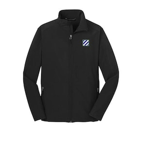 May include: Black softshell jacket with a full-length zipper and a stand-up collar. Features a small emblem on the chest with blue and white stripes. Includes two zippered pockets on the sides.