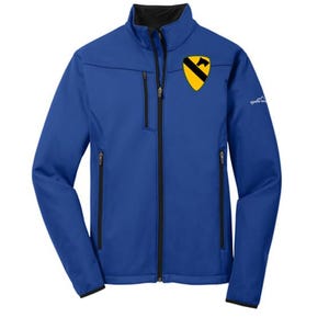May include: Royal blue softshell jacket with a black zipper and collar. Features a yellow and black emblem on the chest and two zippered pockets. The Eddie Bauer logo is on the sleeve.