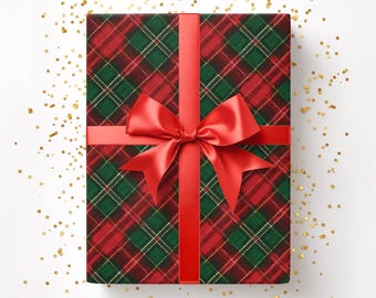 May include: A wrapped gift with a red satin bow and ribbon. The gift box is covered in a red, green, and white plaid pattern. Gold confetti is scattered around the gift on a white background. The gift is ready for the holidays.