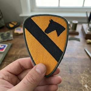 May include: A handmade, wooden cutting board with a natural finish. The board features a live edge on one side and a rectangular shape. It is approximately 18 inches long and 12 inches wide.