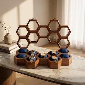 May include: A wooden watch display case with a honeycomb design. The case is made of dark brown wood and features individual compartments with blue velvet cushions to hold watches. The top section has open hexagonal shelves.