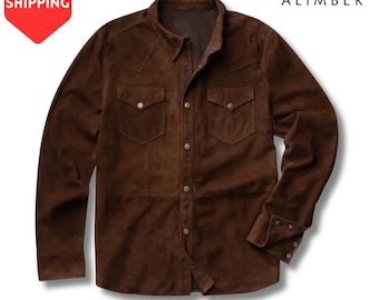 May include: A brown suede shirt with two chest pockets and button closures. The long-sleeved shirt has a classic collar and buttoned cuffs. The brand name "ALIMBER" is visible in the upper right corner.