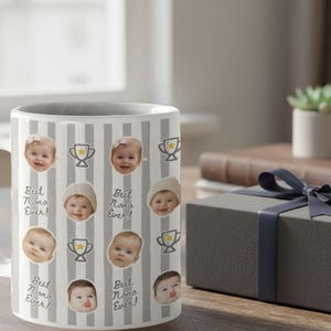 Personalized ceramic mug with repeating baby face photos and gray striped trophy pattern, custom baby picture coffee cup designed as a keepsake gift for parents or grandparents.