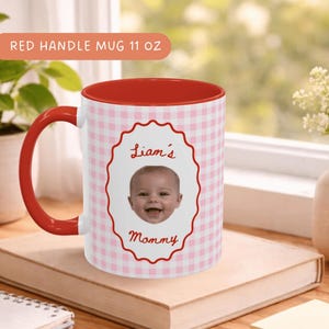 Personalized coffee mug with red gingham check pattern and red handle, featuring a smiling baby portrait, custom gift for Mom, Dad, Grandma and Grandpa