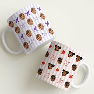Personalized ceramic mugs with repeating baby face photos with purple and red striped dinosaurs and starts pattern, custom baby picture coffee cup designed as a keepsake gift for parents or grandparents.