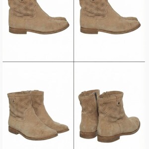 May include: Tan suede ankle boots with perforated detailing on the upper shaft. The boots have a low heel and a side zipper. The boots are displayed in multiple views against a white background.