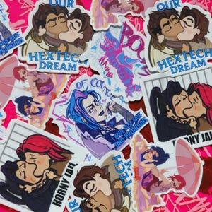 May include: A collection of colorful stickers featuring cartoon illustrations. The stickers display characters in various poses, some kissing. Text includes "HEXTEC DREAM", "HORNY JAIL", and "I HAVE BLUE HAIR AND PRONOUNS". The background is a bright pink.