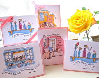 May include: Set of five pink and blue greeting cards with watercolor illustrations of home interiors and floral arrangements. The cards feature handwritten text with quotes about home and simplicity. "It is the small, simple things of life which are the real ones after all."  "Ah! There is nothing like sleeping at home for real comfort."  "Simply, simplify, simplify!"