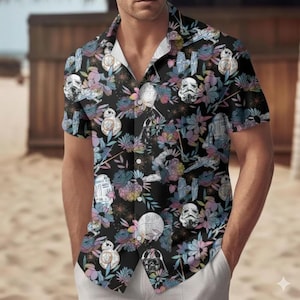 May include: Black button-down shirt with a floral and Star Wars character pattern. The design includes Stormtroopers, BB-8, and Darth Vader, set against a backdrop of colorful flowers. The shirt has short sleeves and a classic collar.