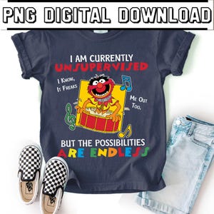 May include: A navy blue t-shirt with the text "I AM CURRENTLY UNSUPERVISED" and a cartoon character playing a drum. The shirt also features the text "BUT THE POSSIBILITIES ARE ENDLESS". A pair of black and white checkered slip-on shoes and denim shorts are also in the image.